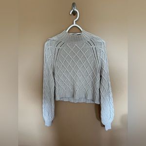 Size xs American Eagle tan sweater.